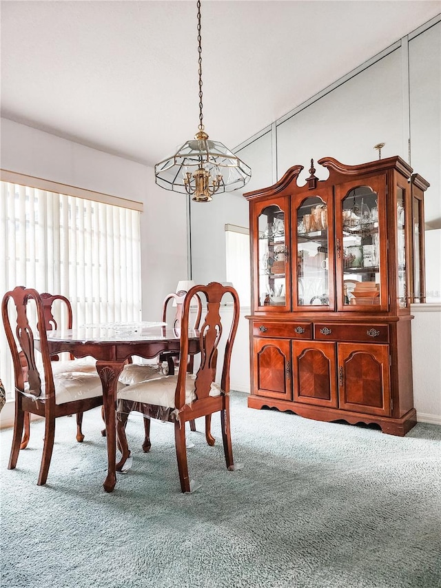 5805 Danterbury Ct, Lakeland, FL 33810 - dining room with carpet floors and an inviting chandelier