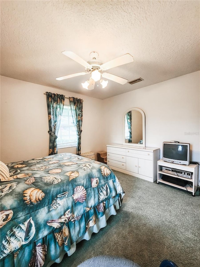 5805 Danterbury Ct, Lakeland, FL 33810 - carpeted bedroom with ceiling fan and a textured ceiling