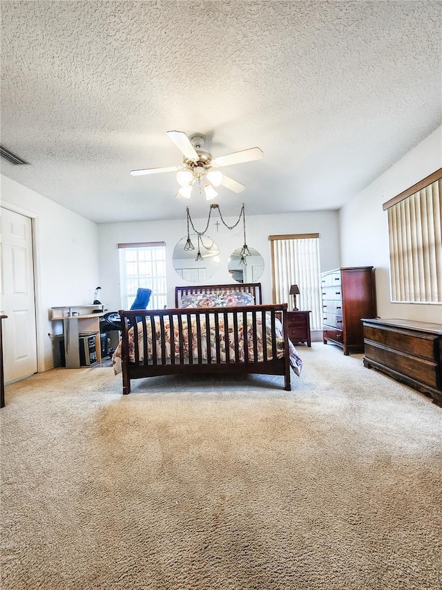 5805 Danterbury Ct, Lakeland, FL 33810 - bedroom featuring ceiling fan, carpet, and a textured ceiling