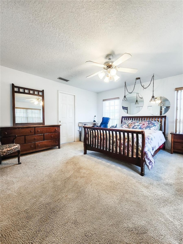 5805 Danterbury Ct, Lakeland, FL 33810 - carpeted bedroom with ceiling fan and a textured ceiling