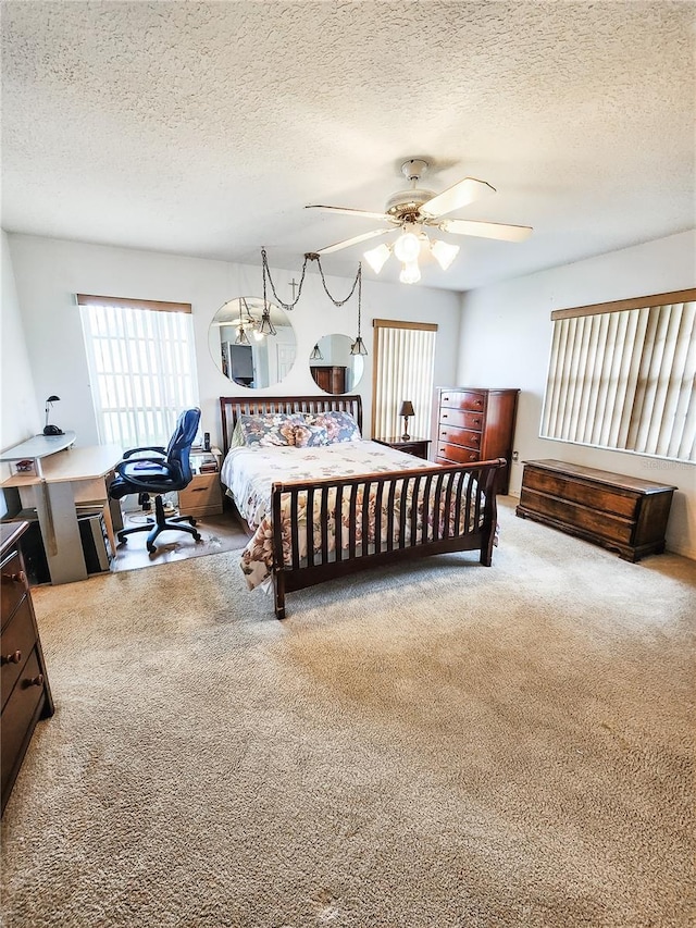 5805 Danterbury Ct, Lakeland, FL 33810 - carpeted bedroom with a textured ceiling and ceiling fan