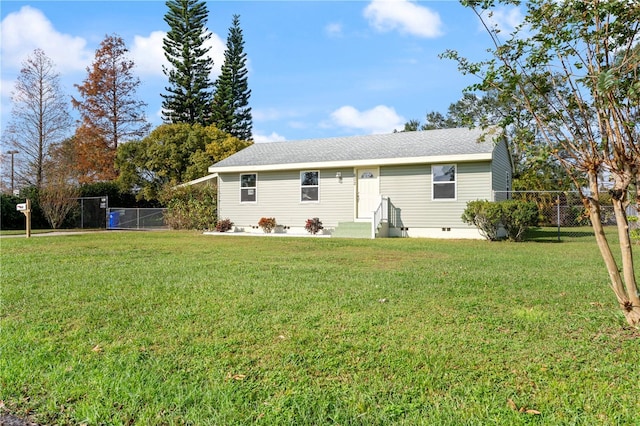 back of property featuring a lawn