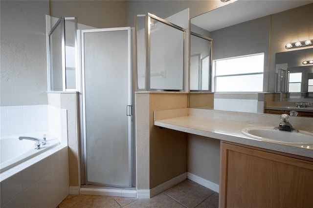 bathroom featuring tile patterned floors, vanity, and independent shower and bath