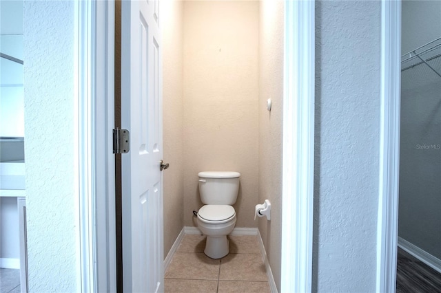 bathroom with tile patterned floors and toilet