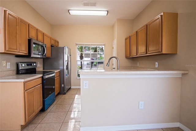 kitchen with kitchen peninsula, light tile patterned floors, and black electric range oven