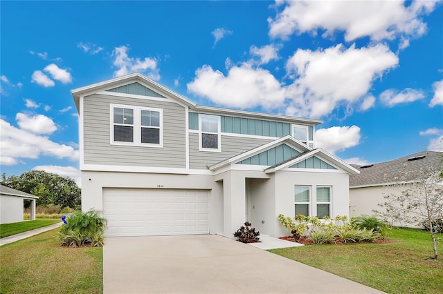 view of front of property with a front yard and a garage