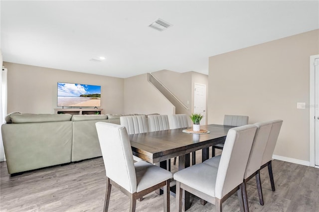 dining room featuring light hardwood / wood-style floors