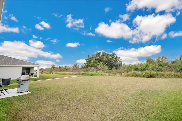 view of yard with central AC