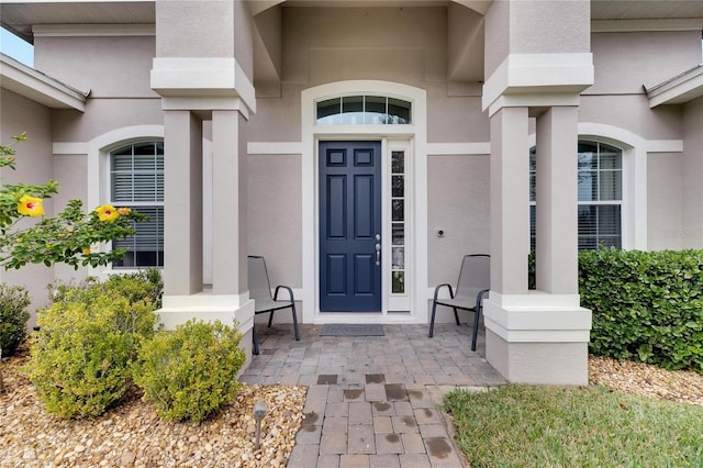 332 Lake Mariana Way, Auburndale, FL 33823 - doorway to property featuring stucco siding