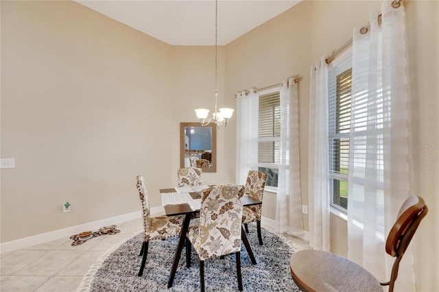 tiled dining area with an inviting chandelier