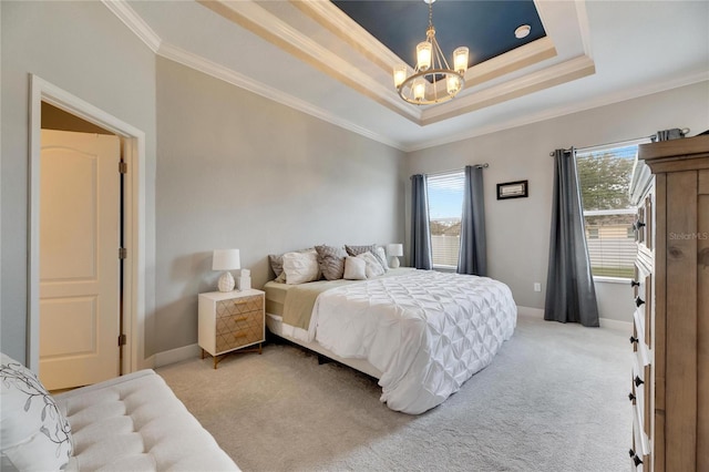 carpeted bedroom with a raised ceiling, crown molding, and an inviting chandelier