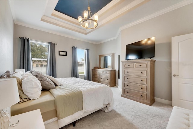 carpeted bedroom with a raised ceiling, ornamental molding, and a notable chandelier