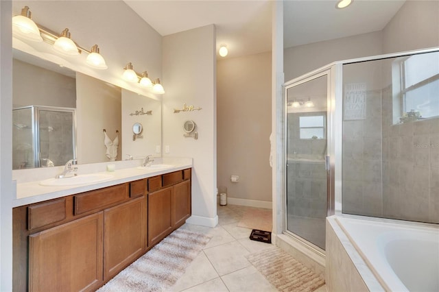 bathroom with tile patterned floors, separate shower and tub, and vanity