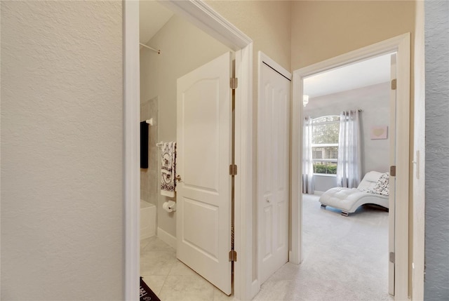 332 Lake Mariana Way, Auburndale, FL 33823 - hall featuring a textured wall and light carpet