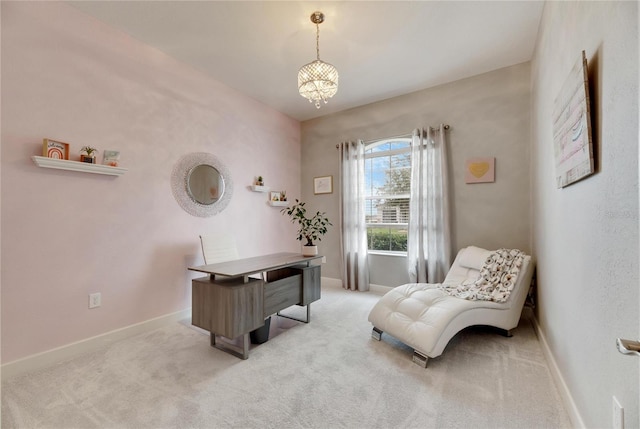 carpeted home office with a notable chandelier