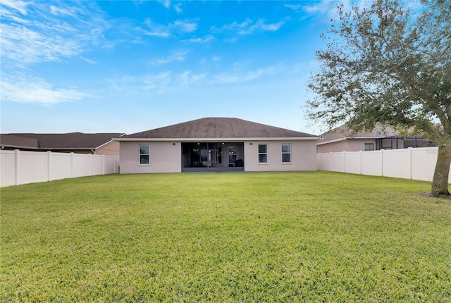 332 Lake Mariana Way, Auburndale, FL 33823 - back of house with stucco siding and a fenced backyard