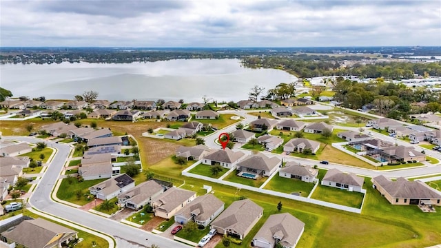 birds eye view of property featuring a water view