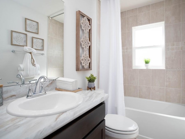 full bathroom featuring shower / tub combo, vanity, and toilet