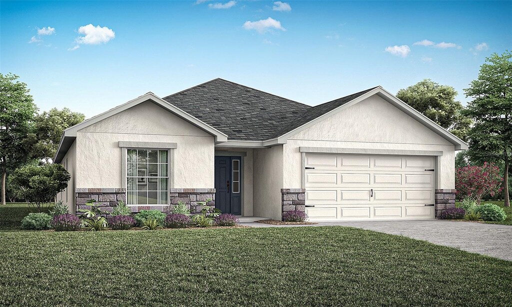 view of front facade with a garage and a front yard