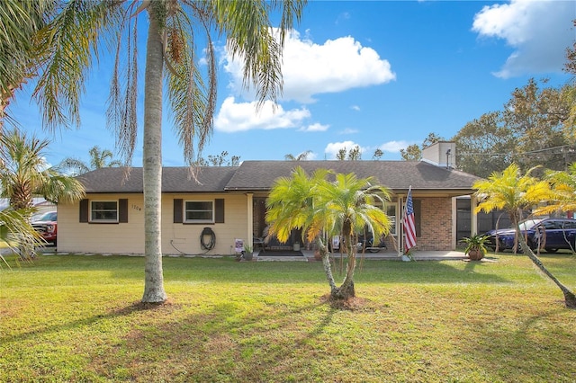 ranch-style home with a front lawn