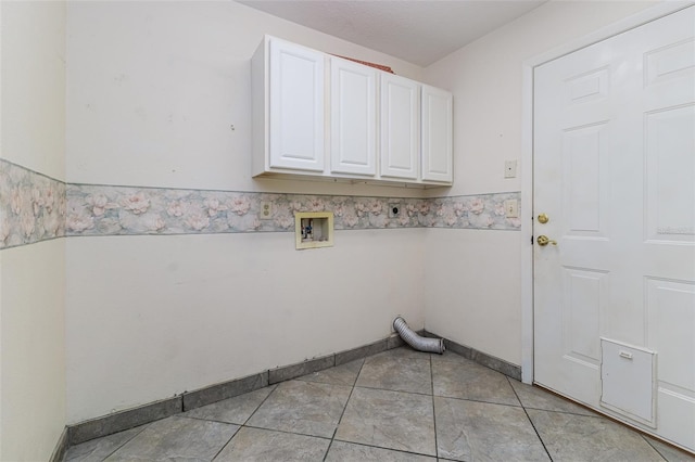 laundry room with cabinets, washer hookup, light tile patterned floors, and electric dryer hookup