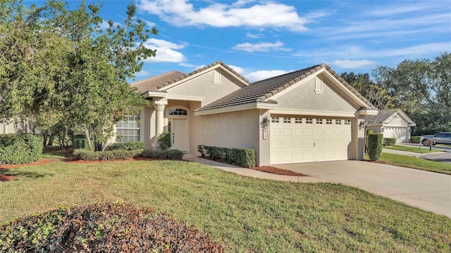 single story home featuring a garage and a front lawn