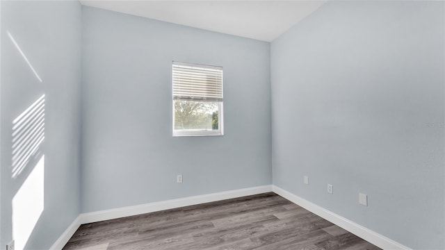 spare room featuring hardwood / wood-style flooring