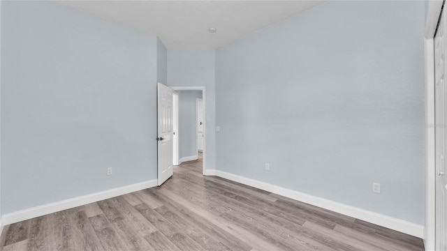 spare room featuring light wood-type flooring