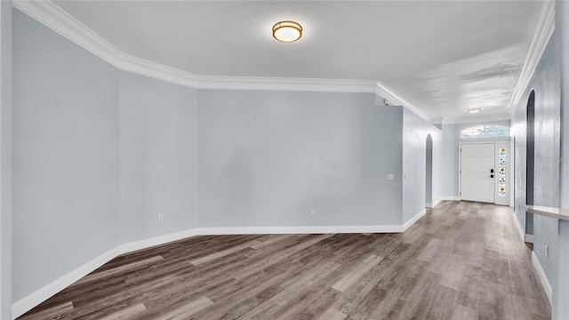 unfurnished room with crown molding and hardwood / wood-style floors