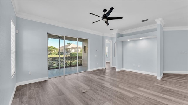 unfurnished room with ceiling fan, light hardwood / wood-style floors, and crown molding