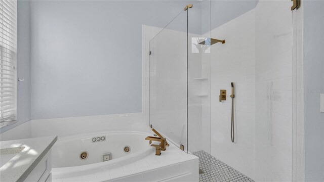 bathroom featuring vanity, separate shower and tub, and plenty of natural light