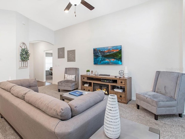 living room with ceiling fan and light carpet