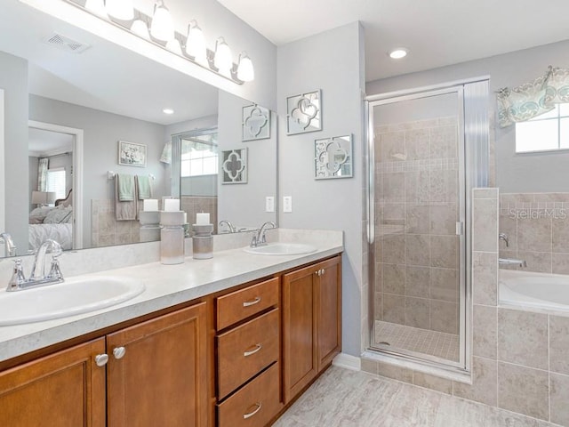 bathroom with vanity and plus walk in shower