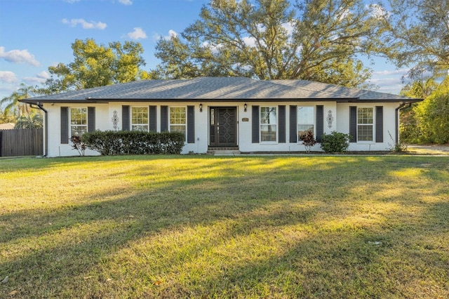 ranch-style house with a front lawn