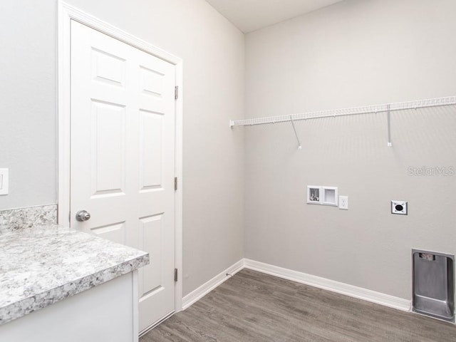 laundry area with hookup for a washing machine, dark wood-type flooring, and hookup for an electric dryer