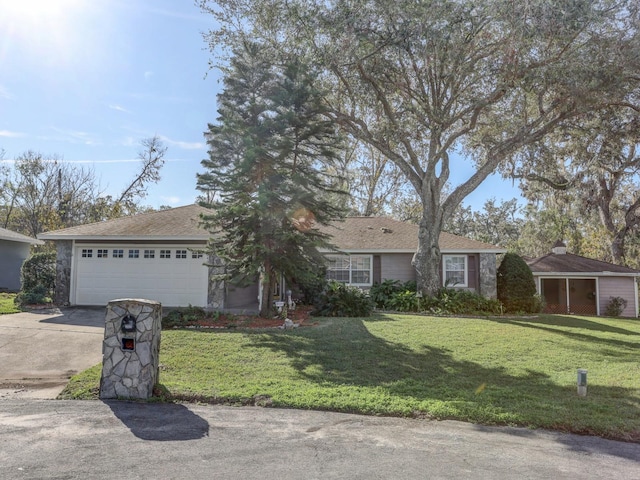 single story home featuring a front yard and a garage