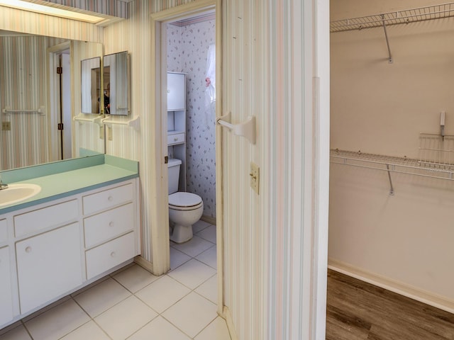 bathroom with tile patterned flooring and vanity