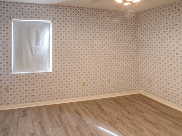 unfurnished room featuring hardwood / wood-style floors