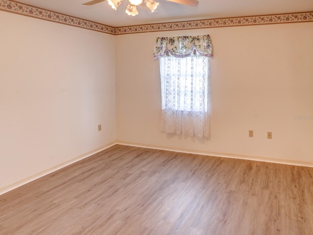 unfurnished room featuring ceiling fan and wood-type flooring