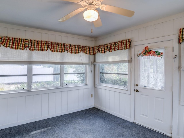 interior space featuring ceiling fan