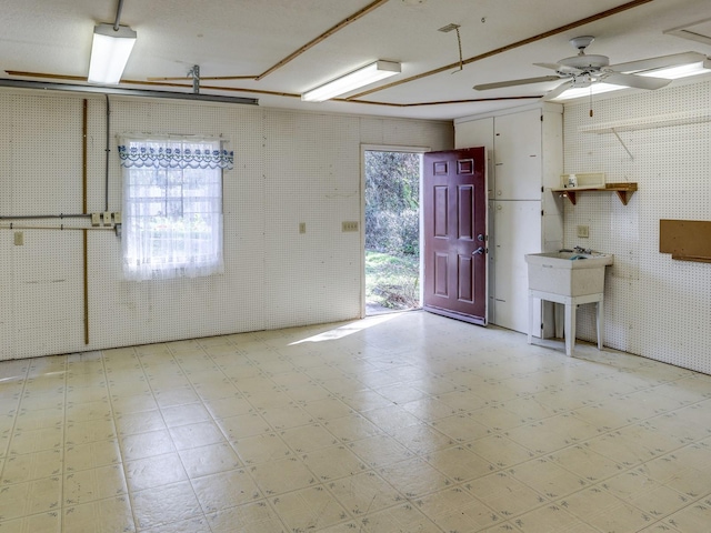 interior space featuring ceiling fan