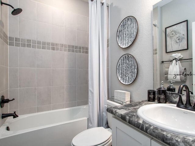 full bathroom with shower / bath combo, vanity, and toilet