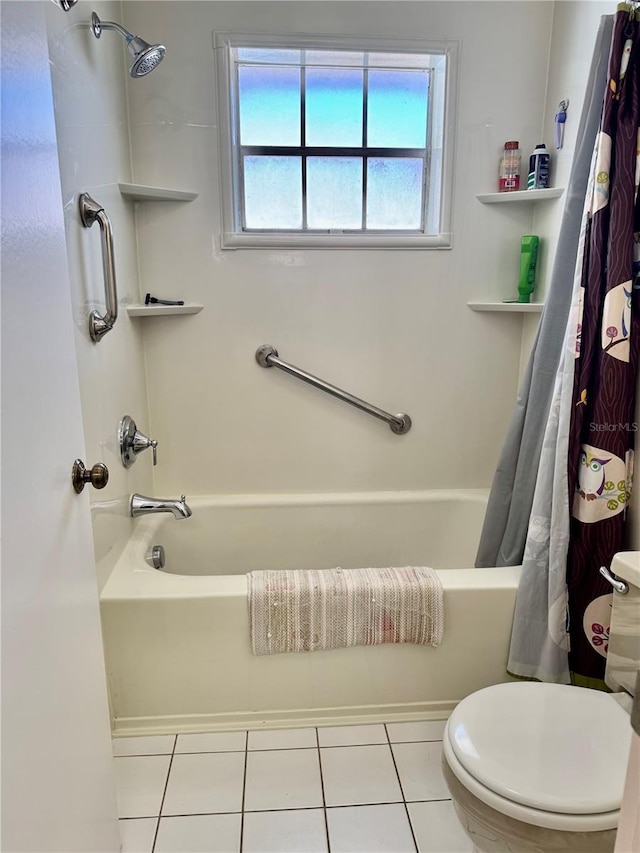 bathroom with tile patterned flooring, shower / tub combo with curtain, and toilet