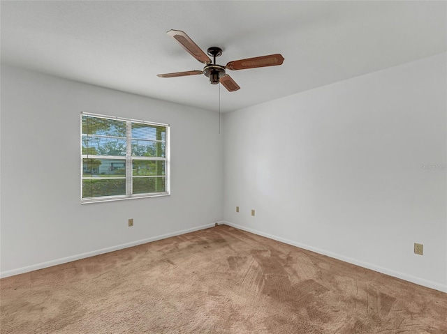 empty room with light carpet and ceiling fan