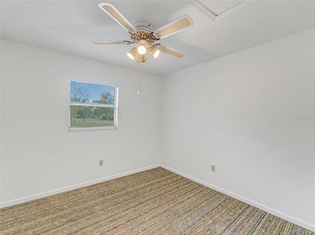 empty room featuring ceiling fan and carpet flooring