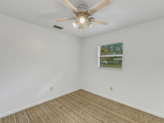 unfurnished room featuring ceiling fan and carpet flooring