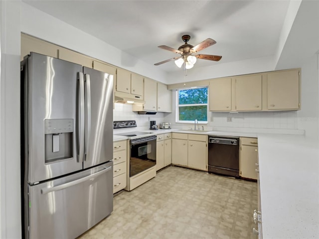 kitchen featuring stainless steel fridge, black dishwasher, cream cabinets, and white range with electric cooktop