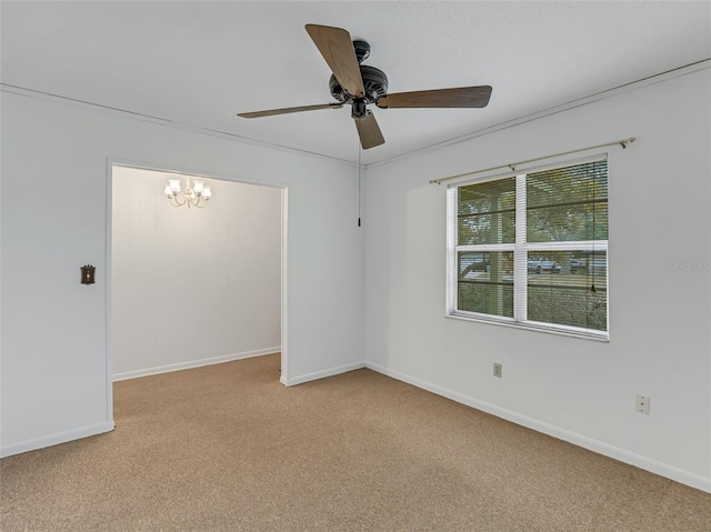 carpeted empty room with ceiling fan with notable chandelier