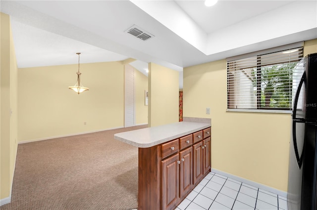 kitchen featuring kitchen peninsula, refrigerator, hanging light fixtures, and light colored carpet