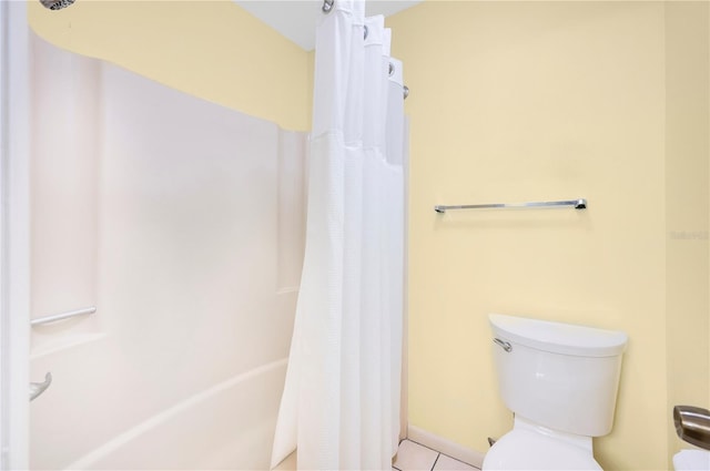 bathroom with tile patterned floors and toilet